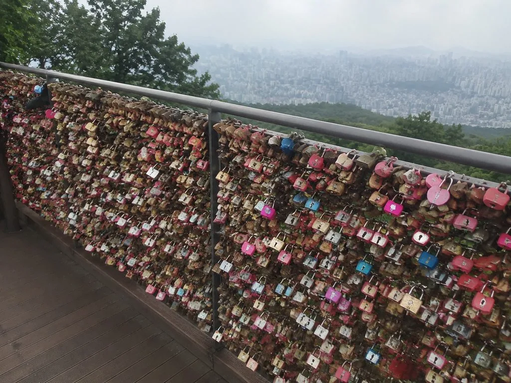 Padlocks attached to the love-lock terrace railings at the tower base